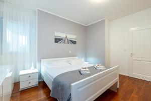 Posteľ alebo postele v izbe v ubytovaní Villa Karmen