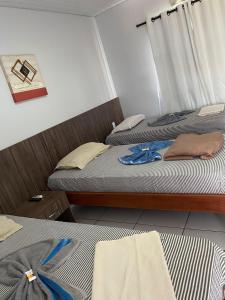 Ένα ή περισσότερα κρεβάτια σε δωμάτιο στο Hotel Cajuapara 2