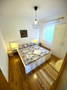 Ένα ή περισσότερα κρεβάτια σε δωμάτιο στο Apartments Miku