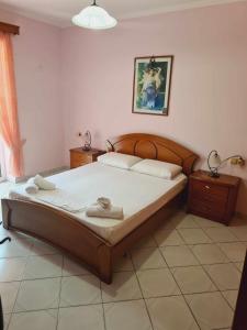 Ένα ή περισσότερα κρεβάτια σε δωμάτιο στο Suzana Apartment