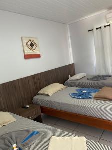Ένα ή περισσότερα κρεβάτια σε δωμάτιο στο Hotel Cajuapara 2