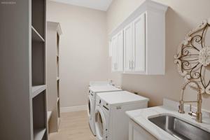 a white kitchen with a sink and a dishwasher at 298 5 Bedrooms Fenced yard New Construction in Robstown