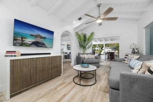 a living room with a couch and a table at The Riverside Retreat 2 in Fort Lauderdale
