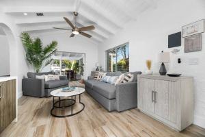 a living room with a couch and a ceiling fan at The Riverside Retreat 2 in Fort Lauderdale