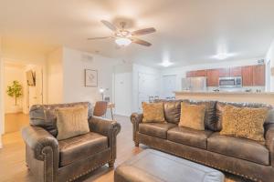 a living room with two couches and a ceiling fan at Lower Northern Tanada Suite 2.0 (B) in North Pole