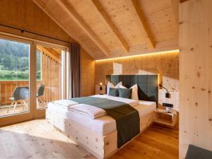 Postel nebo postele na pokoji v ubytování Chalet Refugium Dolomiten