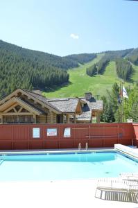 a large swimming pool in front of a building at Edelweiss Condo 223B in Ketchum