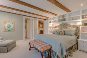 a bedroom with a large bed and a chair at Lodge Apartment II Condo 878 in Sun Valley +36 photos