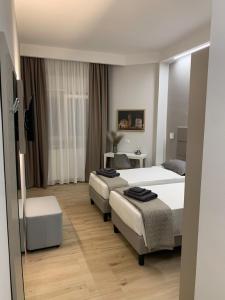 Postel nebo postele na pokoji v ubytování Fla Rooms
