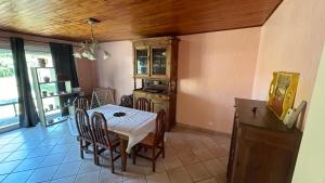 a dining room with a table and chairs at La Pampa in Mimizan +8 photos