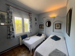 Postel nebo postele na pokoji v ubytování Vall gran 12