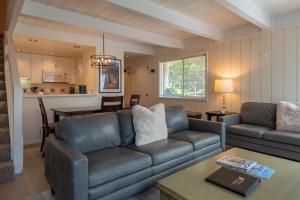 a living room with a couch and a table at Villager Condo 1207 in Sun Valley