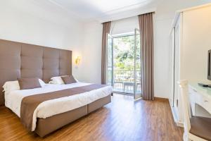 Postel nebo postele na pokoji v ubytování Grand Hotel Parco del Sole - All Inclusive