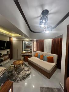 a living room with a bed and a table at Luxurious room غرفة فندقية فاخرة in Cairo