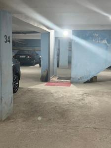 a parking garage with a car parked in it at Elegant and Comfortable Apartment in the Heart of Rabat in Rabat +37 photos
