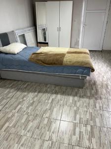 a bedroom with a bed and a wooden floor at Apartment rebl Breza in Breza