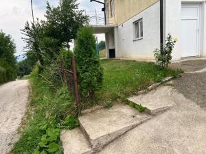 a fence on the side of a house at Apartment rebl Breza in Breza
