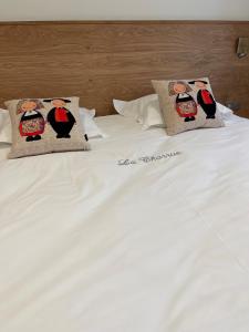 Postel nebo postele na pokoji v ubytování Hôtel Restaurant La Charrue