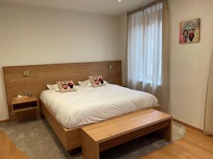 Postel nebo postele na pokoji v ubytování Hôtel Restaurant La Charrue