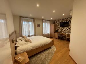 Postel nebo postele na pokoji v ubytování Hôtel Restaurant La Charrue