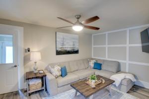 a living room with a couch and a table at Family-Friendly House Walk to Lake Michigan! in Sheboygan