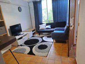 Χώρος καθιστικού στο Appartement T2 meublé tout confort