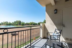 a balcony with a bench and a view of a beach at Modern Suitevipwifipool2 King Bedsac in Santa Clarita