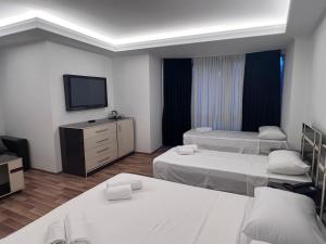 Postel nebo postele na pokoji v ubytování Hotel Argo
