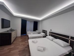Postel nebo postele na pokoji v ubytování Hotel Argo