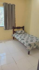 Ένα ή περισσότερα κρεβάτια σε δωμάτιο στο casa em buzios