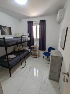 Postel nebo postele na pokoji v ubytování Susan Cosy Apartment, Victoria Gozo