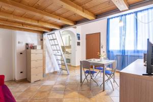 a kitchen and dining room with a table and chairs at Italian Experience-Florentine Careggi Loft in Florence