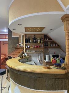 a kitchen with a large island with a sink at Vila Zvezdane večeri in Rudnik +50 photos