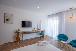Televiisor ja/või meelelahutuskeskus majutusasutuses Cataleya Resort