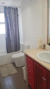 a bathroom with a toilet and a shower curtain at LITTLE PEACEFUL RETREAT Room with bath, Heating, Terrace, Free Wifi Fridge Easy parking in Nueva Andalucia +31 photos