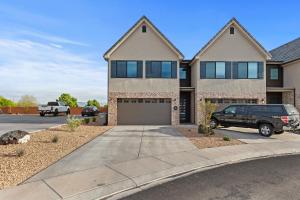 a house with a car parked in a driveway at NEW 3bd, 2.5 bath w Game room lounge, Hot tub, pool, fire pit, and more in Santa Clara