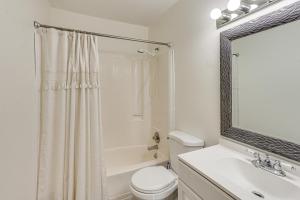 a bathroom with a toilet and a sink and a mirror at 5 Mi to Downtown Harrisburg - Family Home! in Harrisburg +19 photos