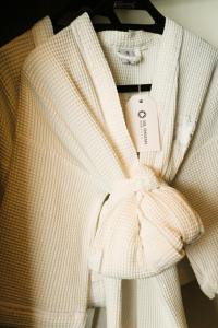 a white sweater with a tag on it at Sol Ipanema Hotel in Rio de Janeiro
