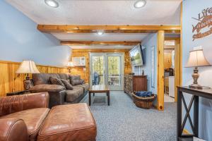 a living room with a couch and a table at Owls Retreat in McHenry