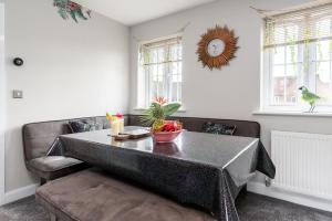 a living room with a table and a couch at Doncaster Lakeside Paradise Place in Doncaster +20 photos
