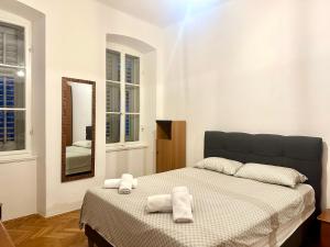 Posteľ alebo postele v izbe v ubytovaní Navis city apartments