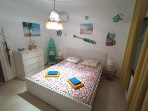 a bedroom with a bed in a room with a toy at Villa Panoramica / La Nucia (Costa Blanca) in La Nucía