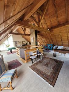 a large living room with chairs and a table at villa deloro in Orbey