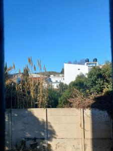 a view from a window of a wall and buildings at Departamento centrico in Tandil