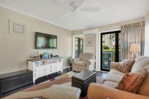 A television and/or entertainment centre at Ocean Forest Villas Cozy Oceanview Unit D116
