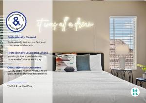 a bedroom with a bed and a sign that reads travel all a dream at Putt Putt Hot Tub Game Room Pool Cornhole in Chandler