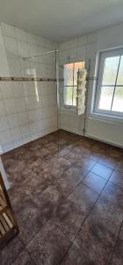 Ένα μπάνιο στο Ferienwohnung An der Teufelsklippe