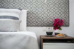 Postel nebo postele na pokoji v ubytování Aurora - Rooms & Suites - Spetses