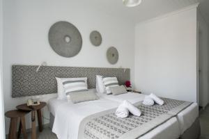 Postel nebo postele na pokoji v ubytování Aurora - Rooms & Suites - Spetses