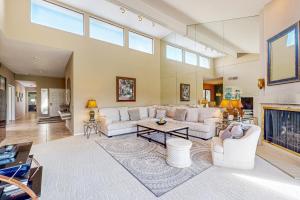 a living room with a couch and a fireplace at Southern Hills Charm Permit# 65256 in La Quinta